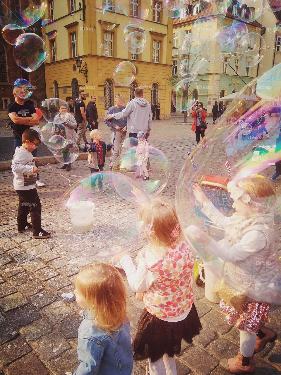 Kids plus bubbles - this combination make you want to become a kid yourself! 

Wrocław, Poland