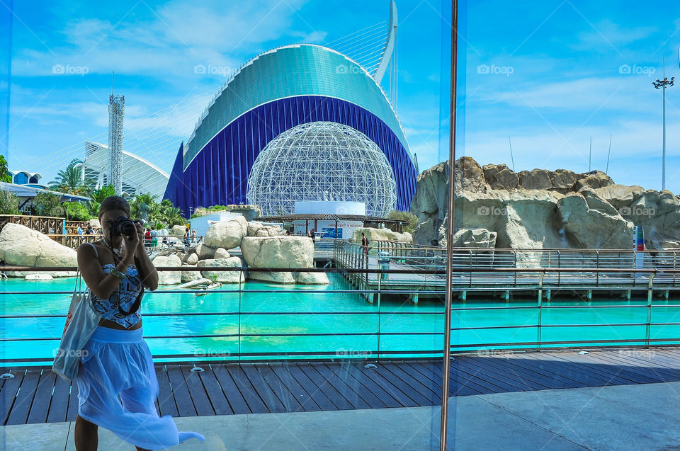 Girl take photo of herself in oceanographic museum in Valencia 