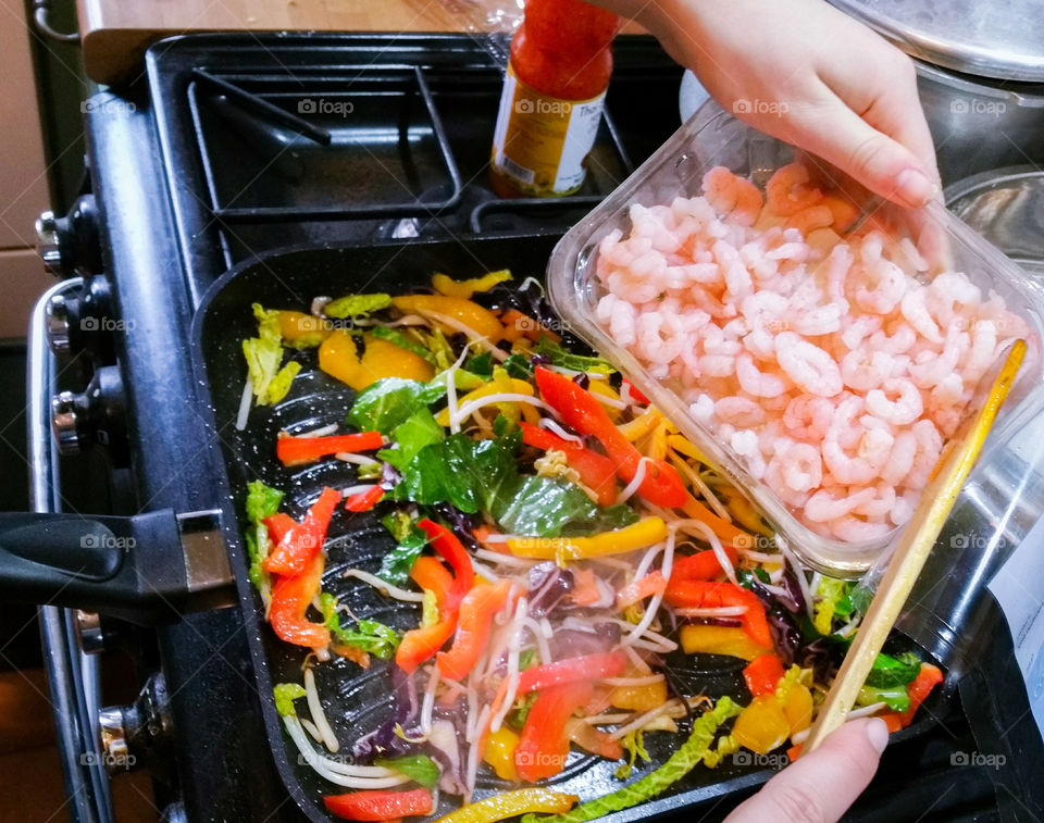 Adding prawns to a stir fry