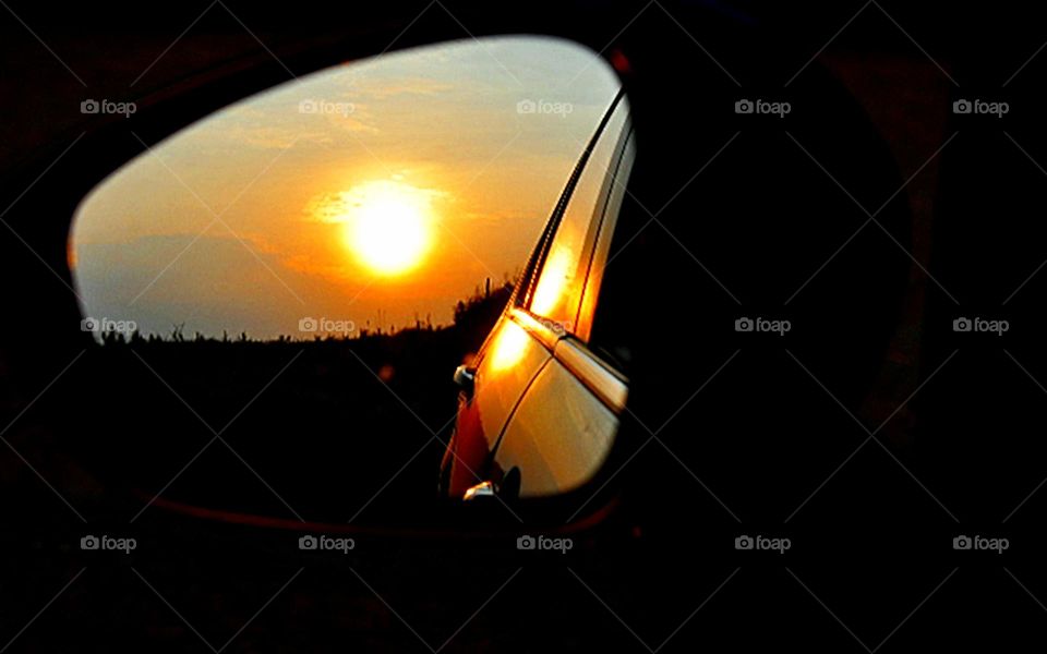 Sol pelo retrovisor