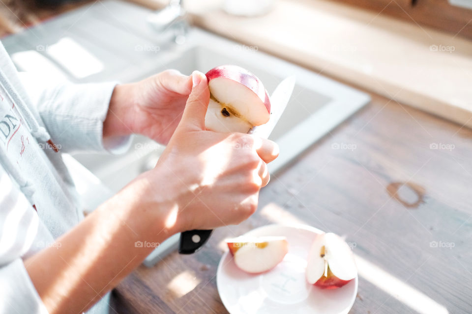 Cutting apple in the kitchen