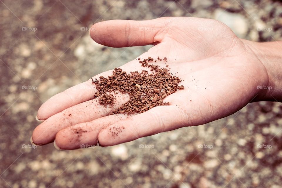 Dry ground on woman hand