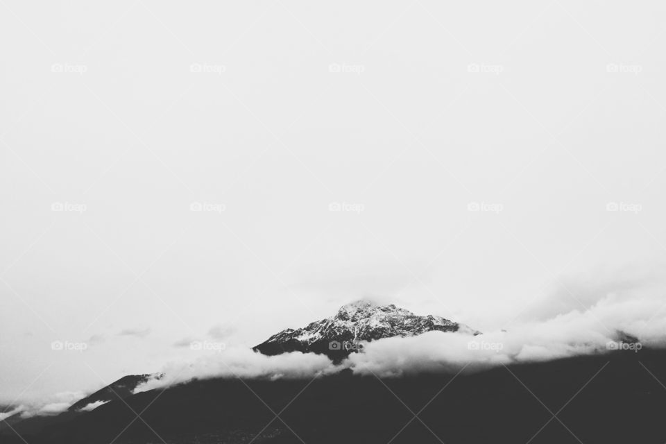 Clouds over mountain peak