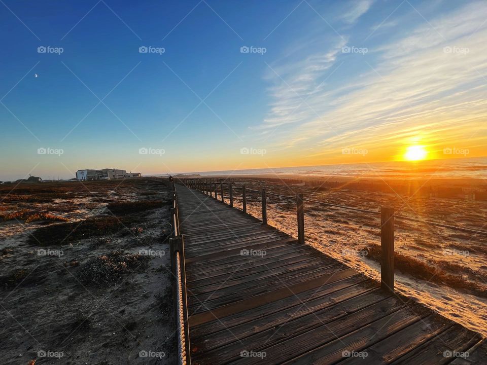 Sunset and moon together at the beach