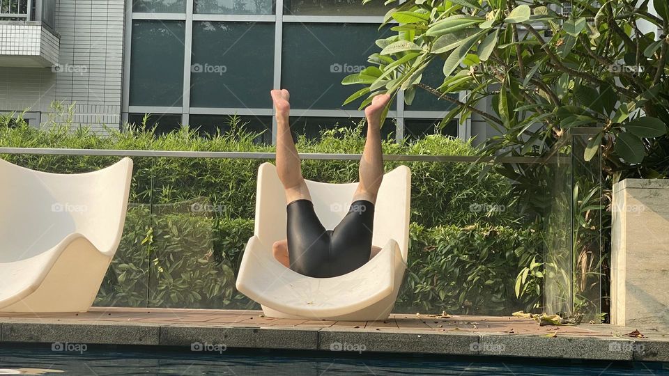 Legs up at the poolside 