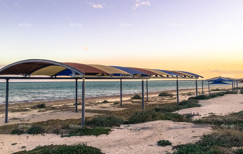 Tent Pergolas on the beach south Australia at sunset ocean background