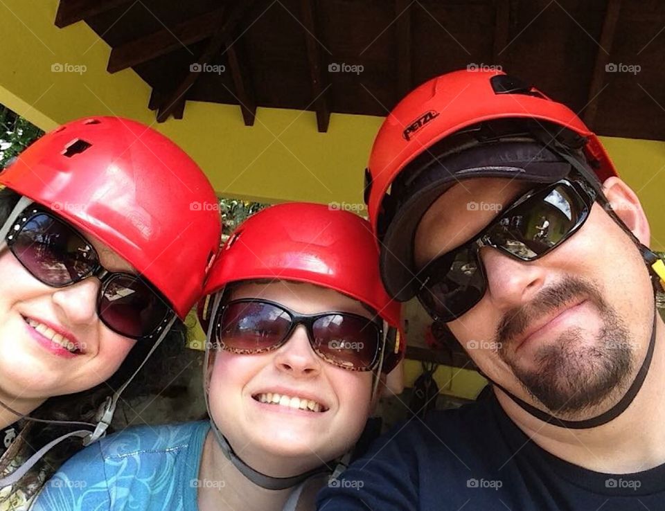 Wearing out hard hats to zip line in the tropics of Hilo, Hawaii 