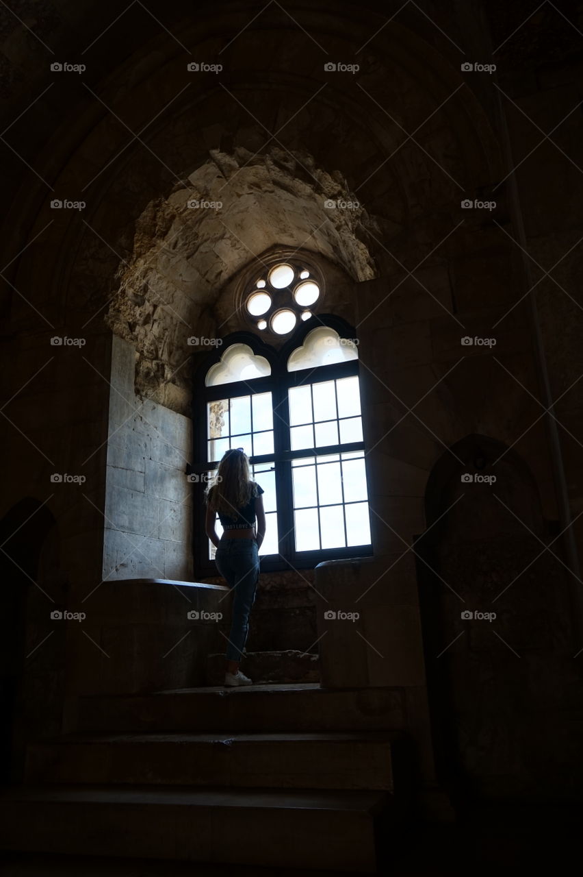 Girl at Castel del monte window (castle)