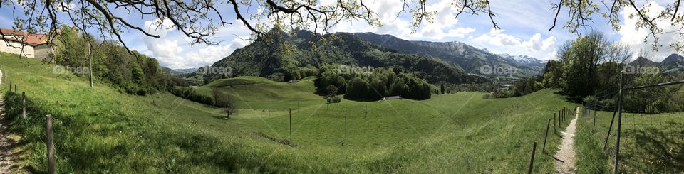Panoramic view of valley in Gruyere, Switzerland. 