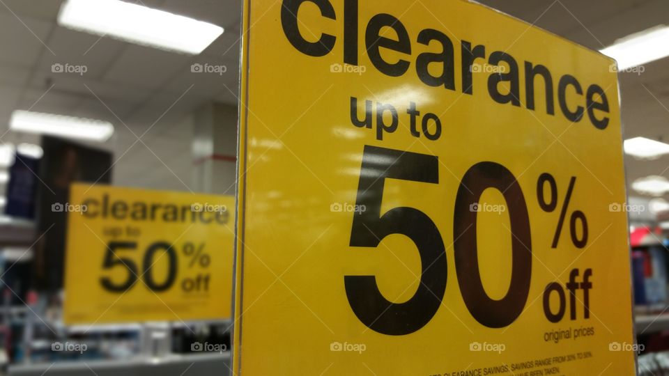 Clearance up to 50% signs at a store