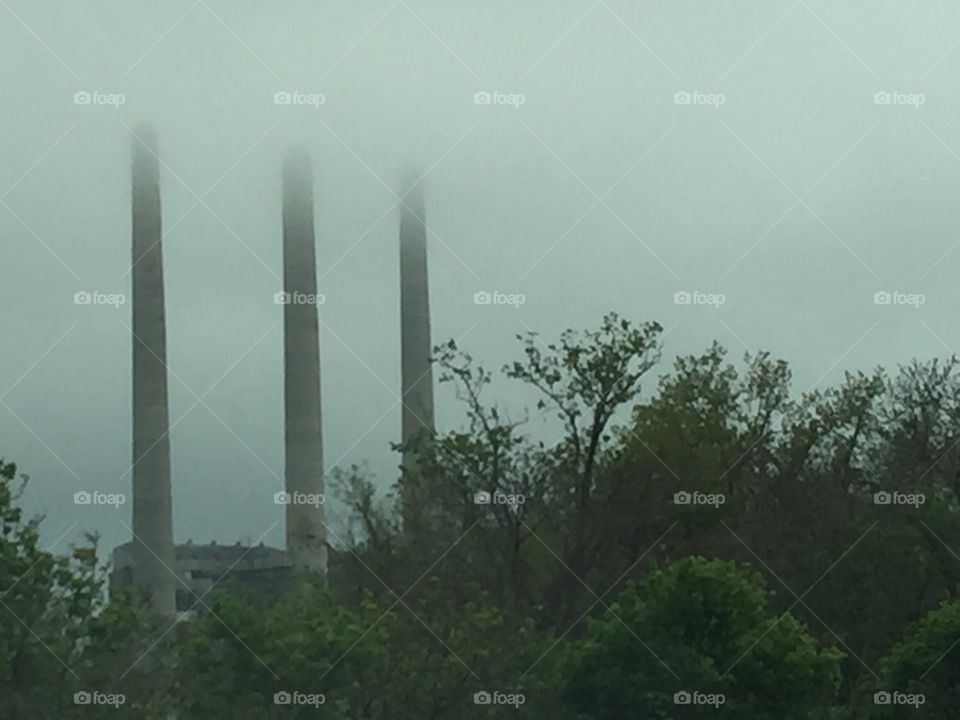 Smoke stacks in fog
