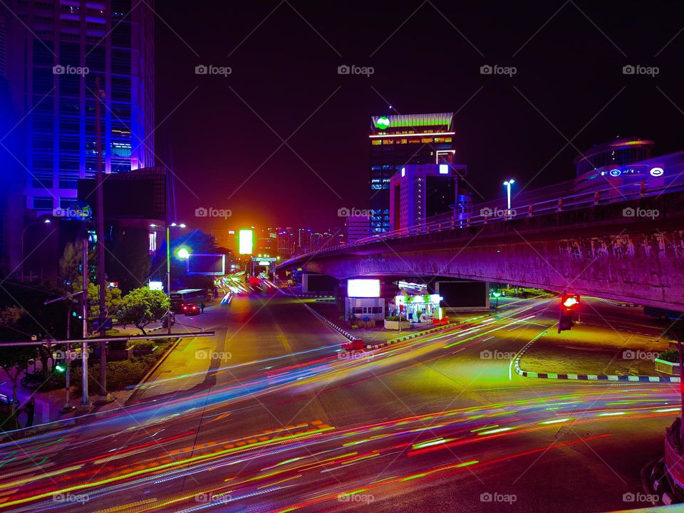 colorful vehicle lights on the streets of the capital city of Jakarta at night