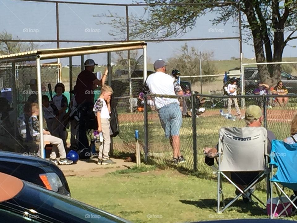This is a picture of my nephew in between innings.