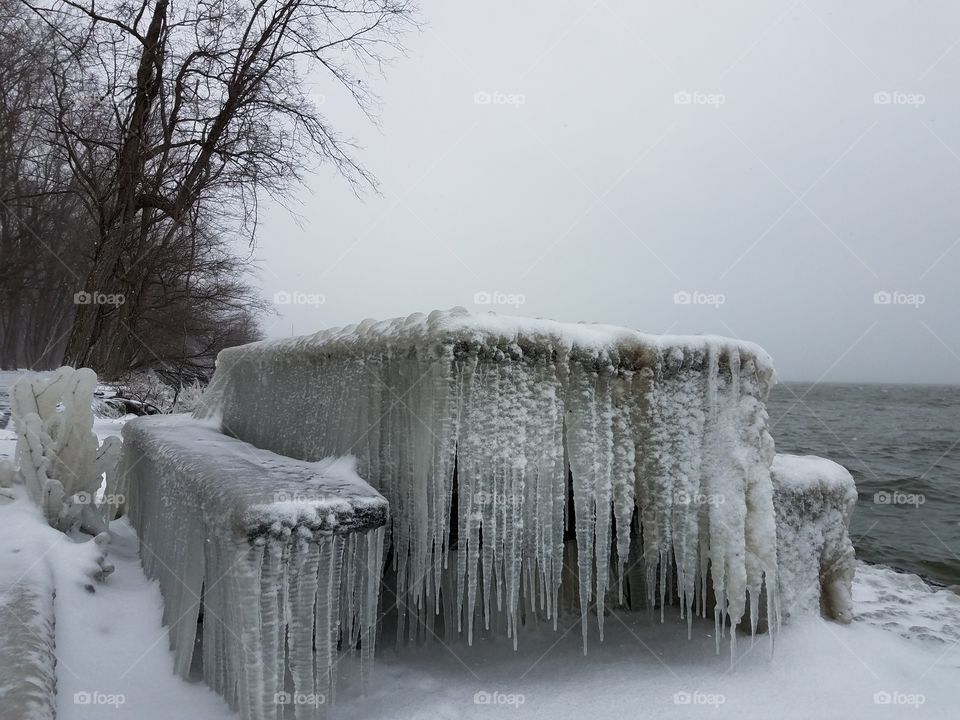 Ice covered picnic table on a wintry day