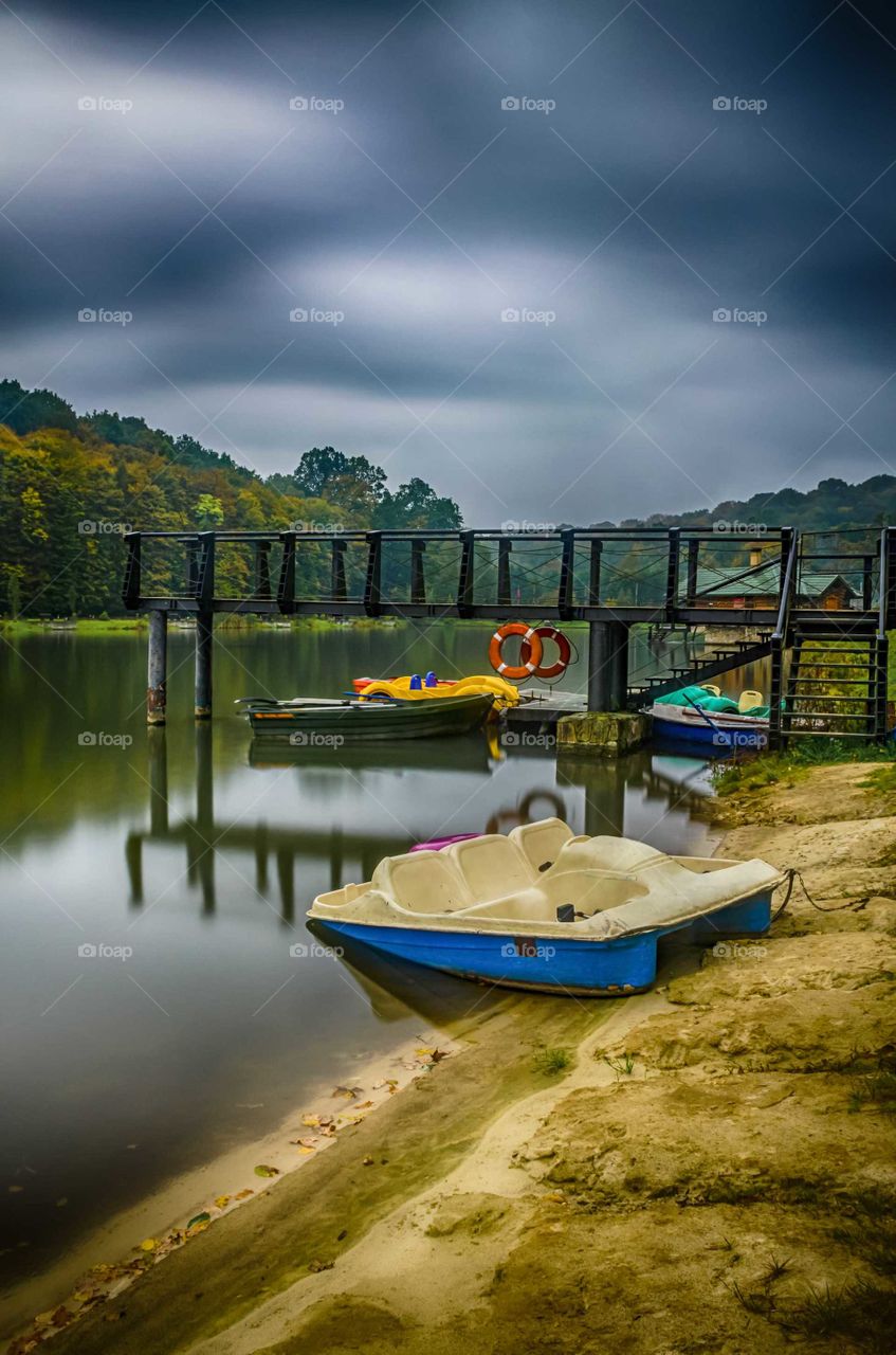 Dramatic​ autumn landscape with lake