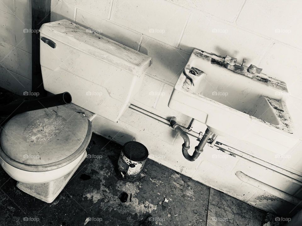 Abandoned And Needing To Be Restored Bathroom With Rusted And Destroyed Elements. 