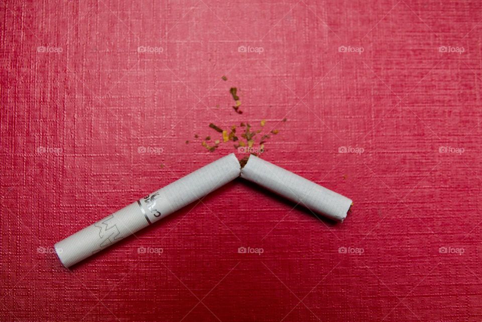 New Year's resolutions to quit smoking. Broken cigarette.