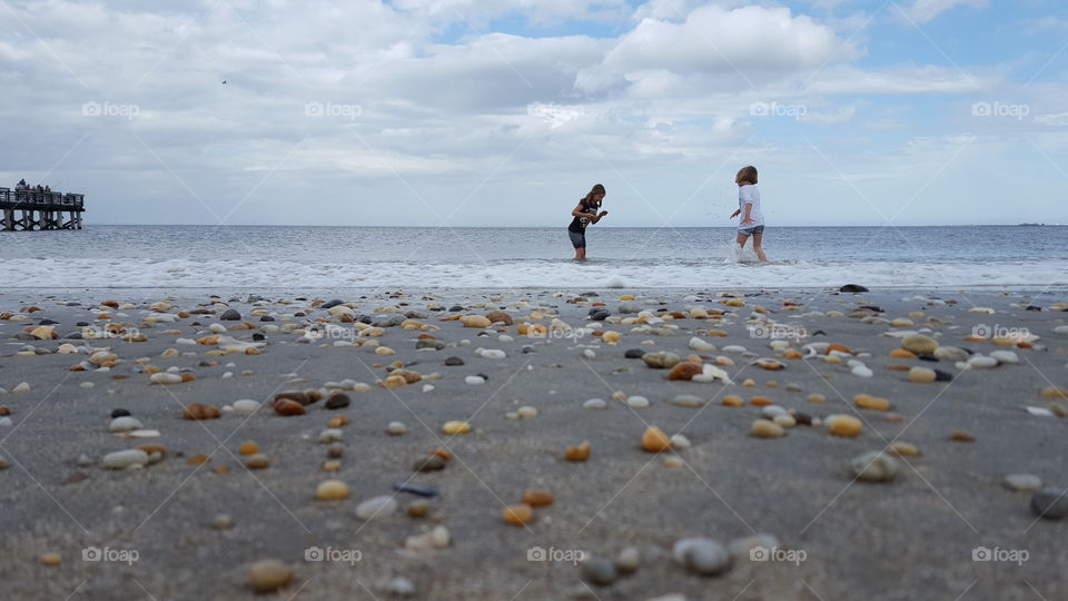 Two girl having fun on the beach