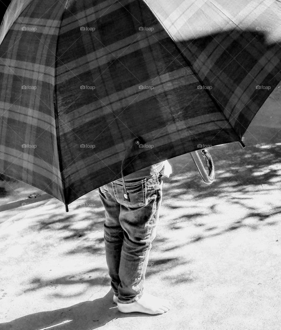great nephew playing with the umbrella after a rainy day