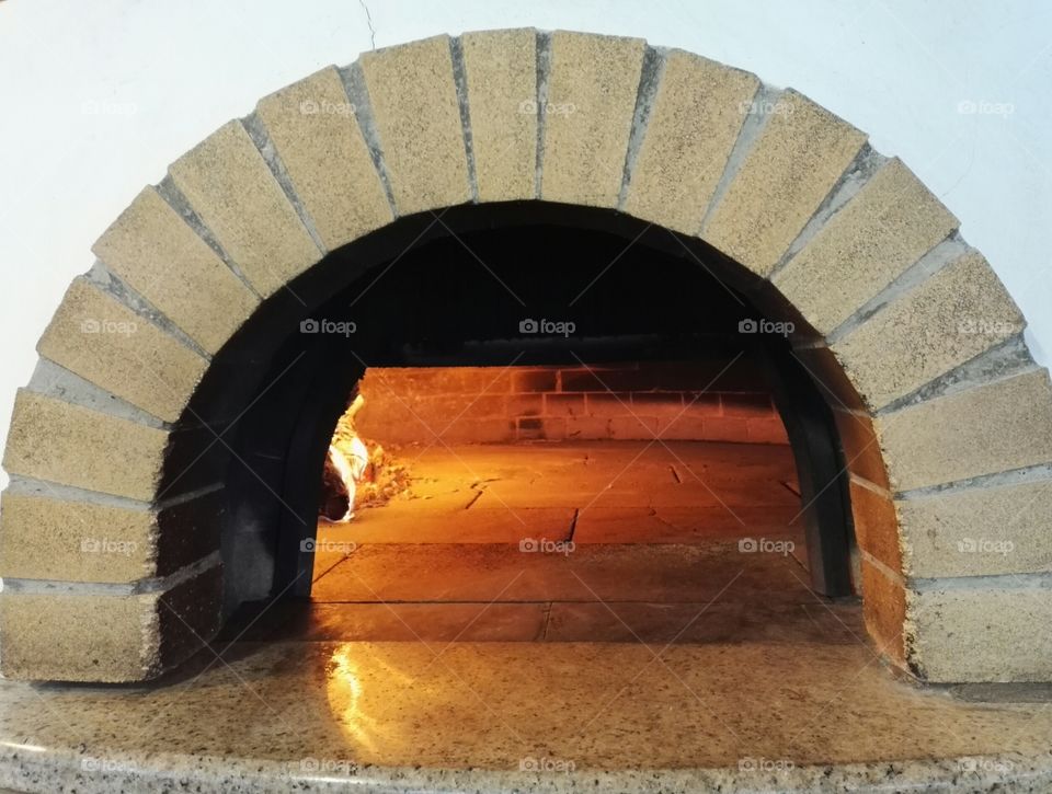 wood fired oven with fire close up