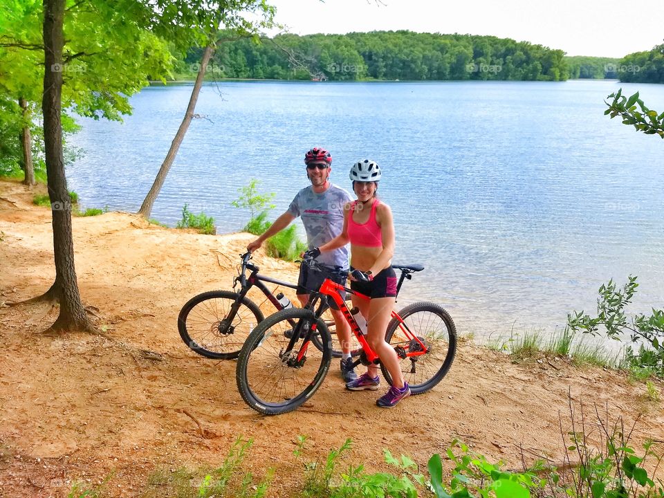 Mountain bike couple by Lake