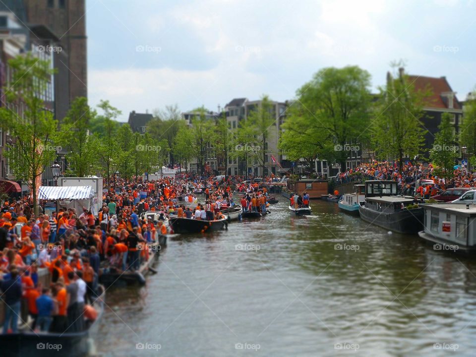 kingsday on the canals in Amsterdam