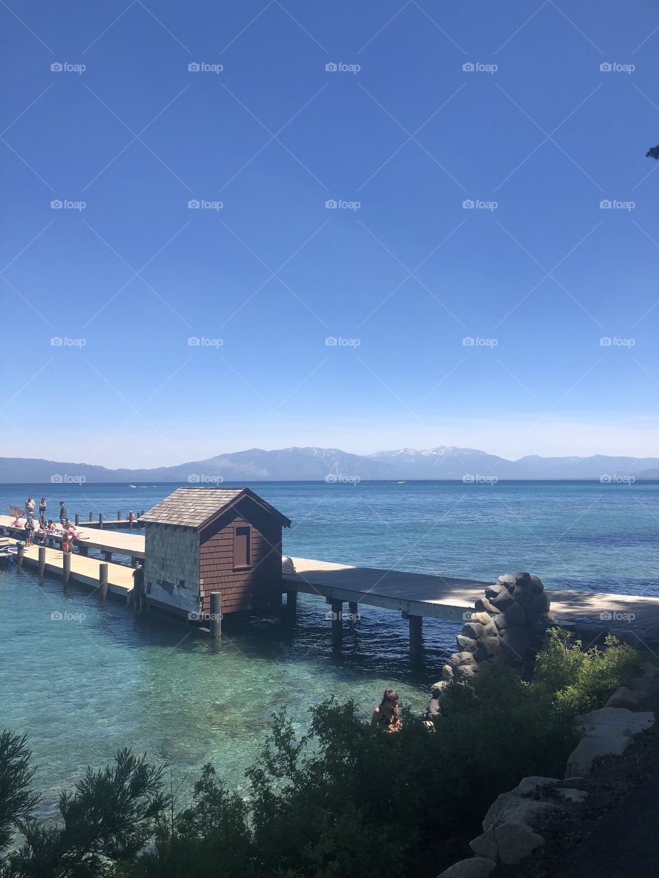 Taken while camping in Lake Tahoe, California. Beautiful clear waters and mountains in view :)
