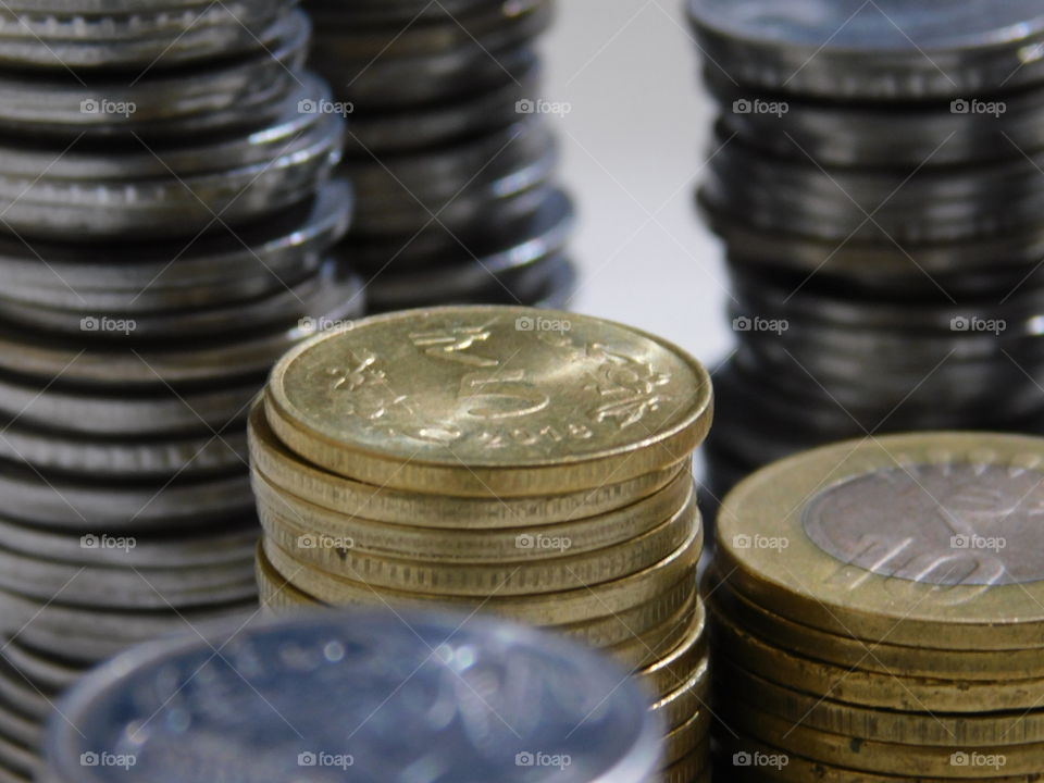 Indian Currency in Rupees - Coins are stacked with Definite Arrangement.