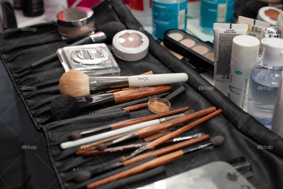 Set for professional make-up.  Brushes, eye shadows, glitter and mascara. Beautician job.  Beauty salon
