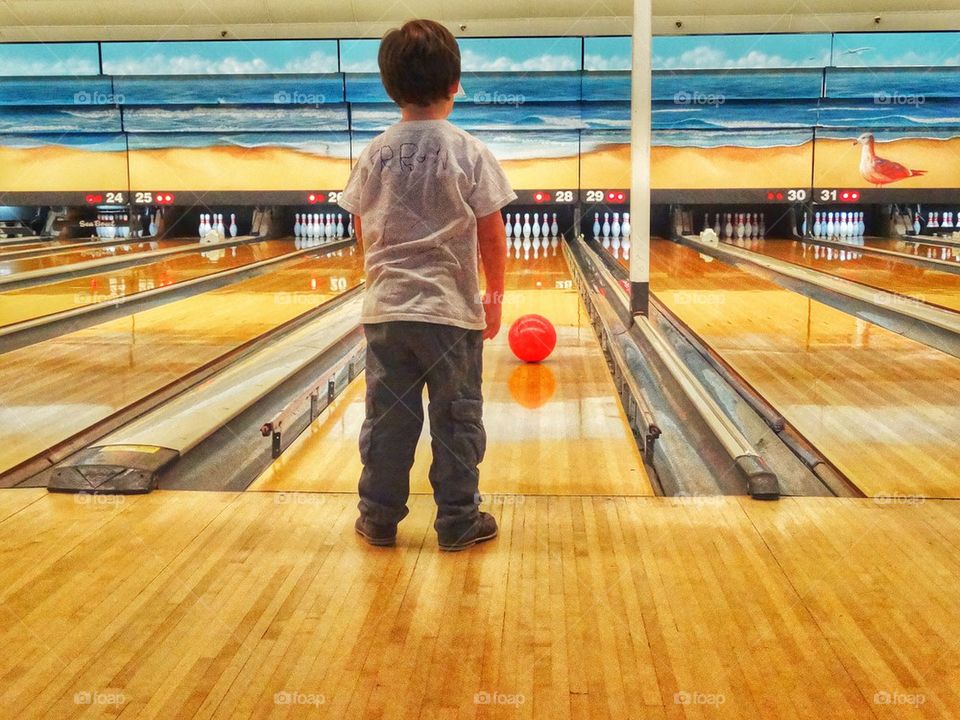 Little Boy Bowling. Family Game Night At The Bowling Alley