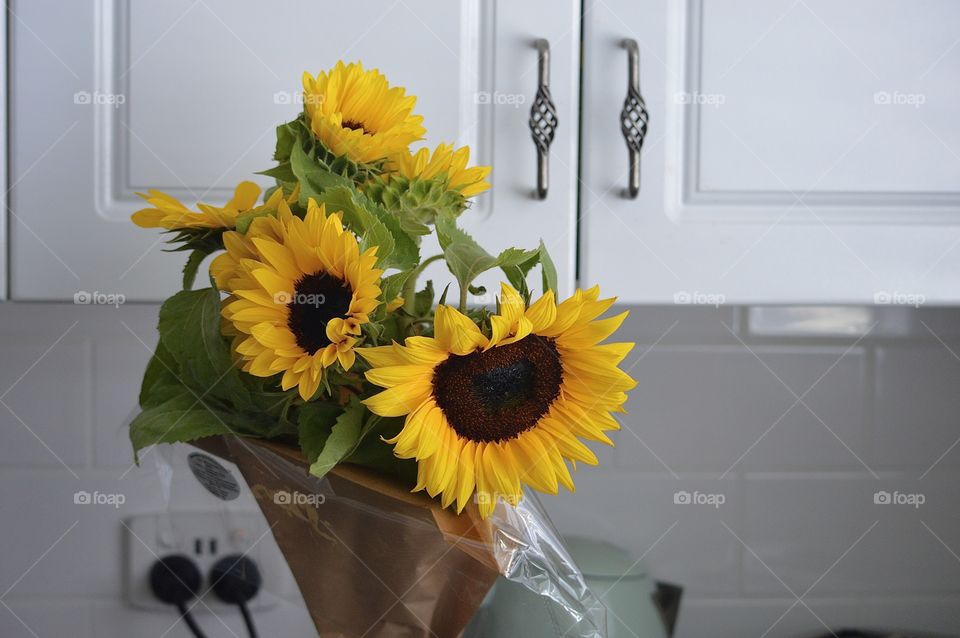 Bright yellow bouquet of sunflowers in the kitchen spreading positive vibes 🌻