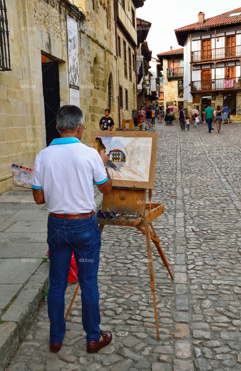 Street artist in Santillana del Mar, Cantabria, Spain.