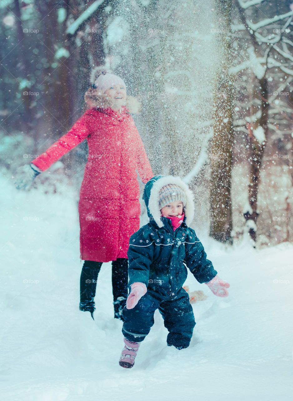 Winter with friends. Spending wintertime outdoors playing with snow