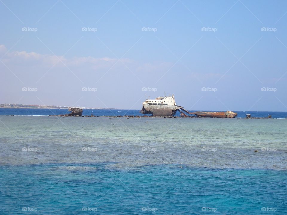 An old rusty ship on coral reefs 