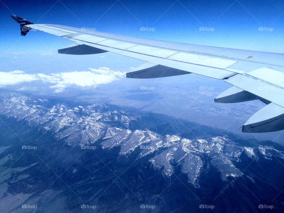 airplane mountains aerial rockies by kaemak