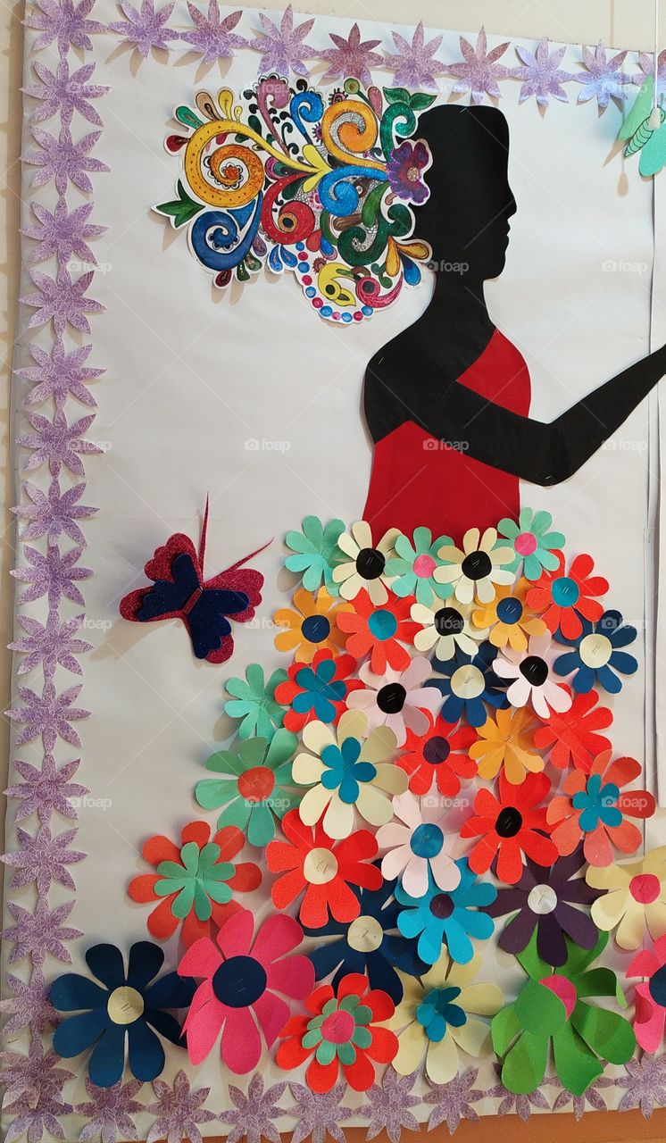 The paper lady looks awesome adorned in those paper flowers