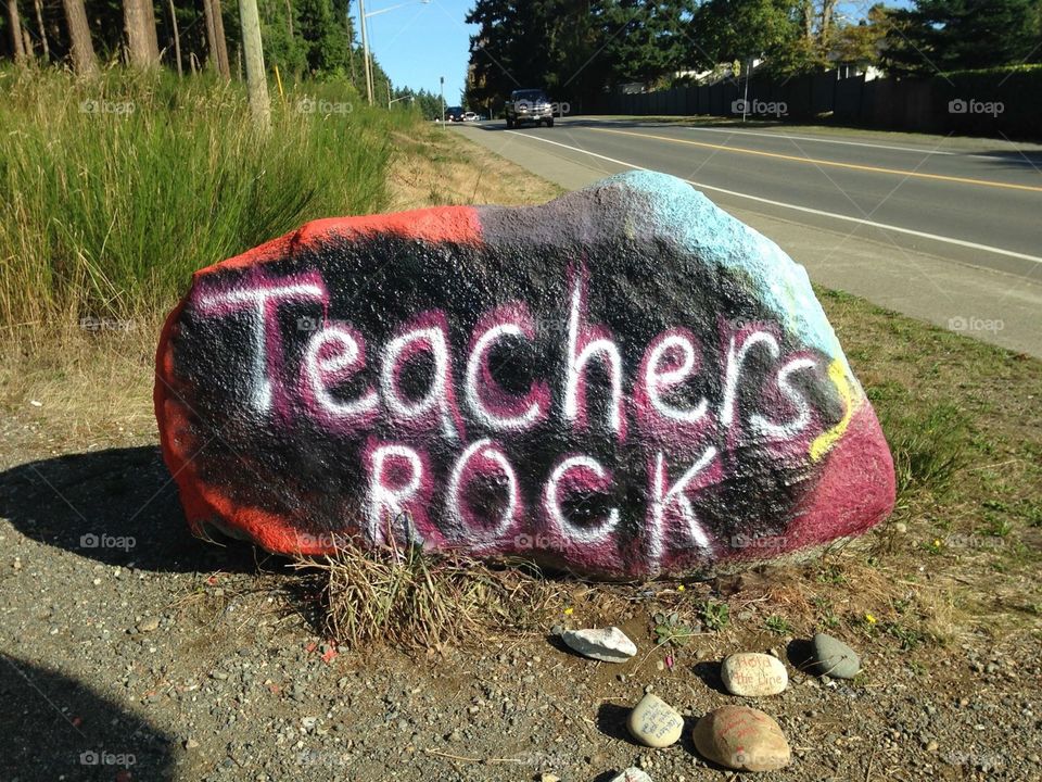 During a heated teacher strike students and parents show their respect for the teachers by painting this beautiful rock on the corner of the school property.