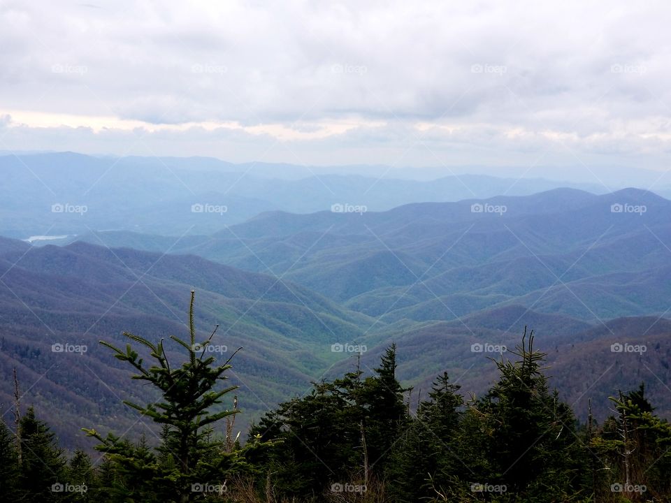 Breathtaking panoramic sweeping views from Clingmans Dome in the Smoky Mountain national park/forest with rolling clouds over North Carolina & Tennessee.