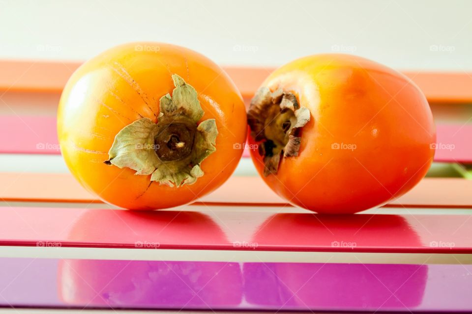 Two persimmon fruits