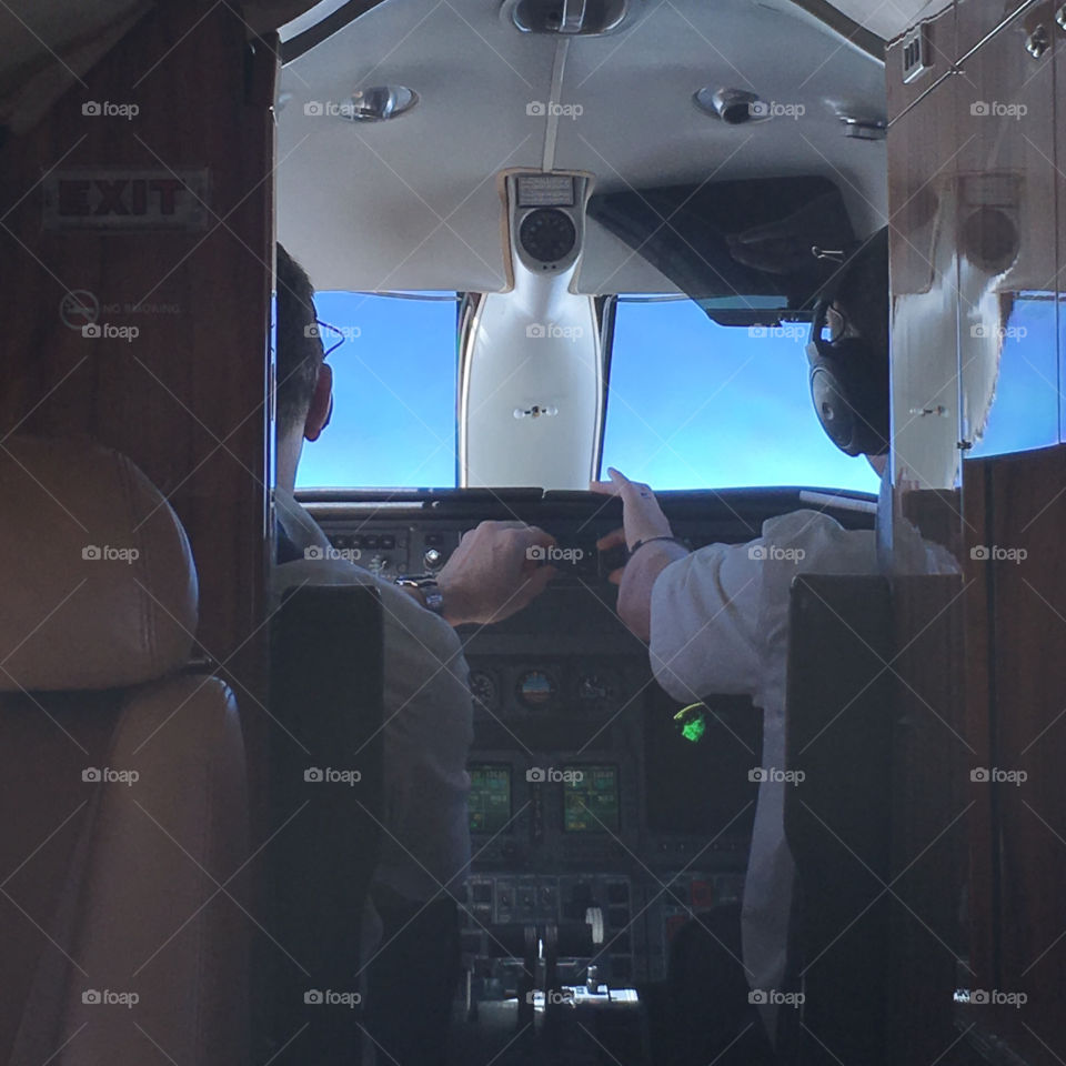 Pilots flying a Lear Jet 