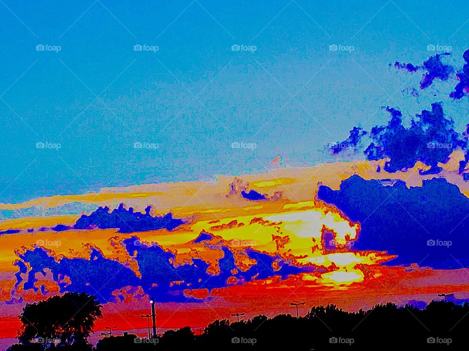 An Orange story interpreted by Spring clouds as setting sun illuminates clouded, paints trees in silhouettes , displays either threatening storms or peaceful fair weather clouds, an abstract painting of nature's beautiful, heavenly, display