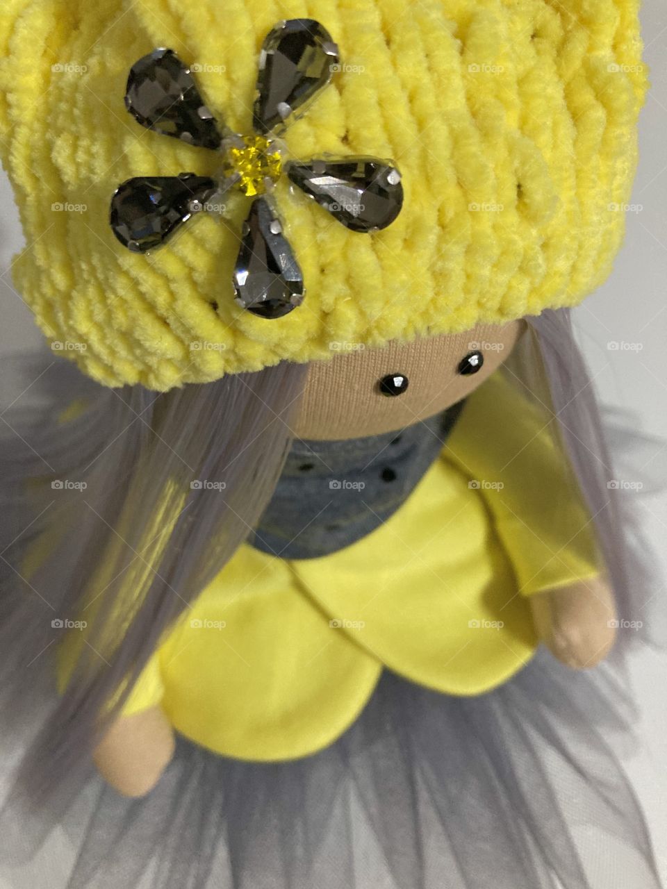 Yellow-grey textile doll