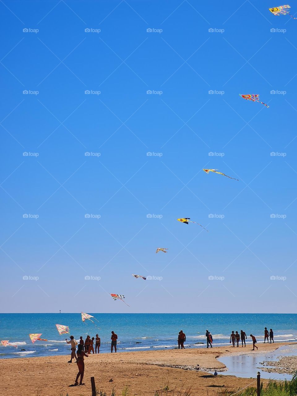 kites fly on the beach of Silvi Marina