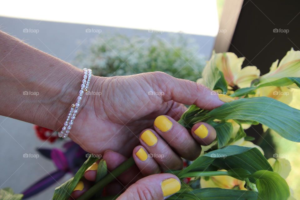 Natural nails  painted yellow with yellow flowers