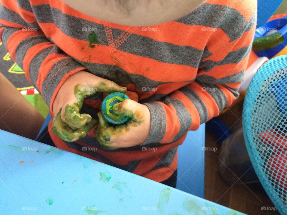 Little painter. Small boy is exploring colors
