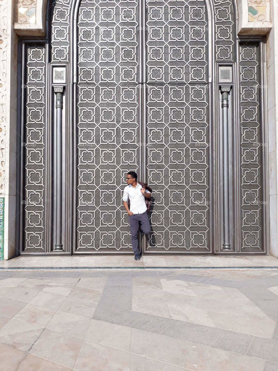 I am standing at one of the doors of the Hassan II Mosque in Casablanca, Morocco.