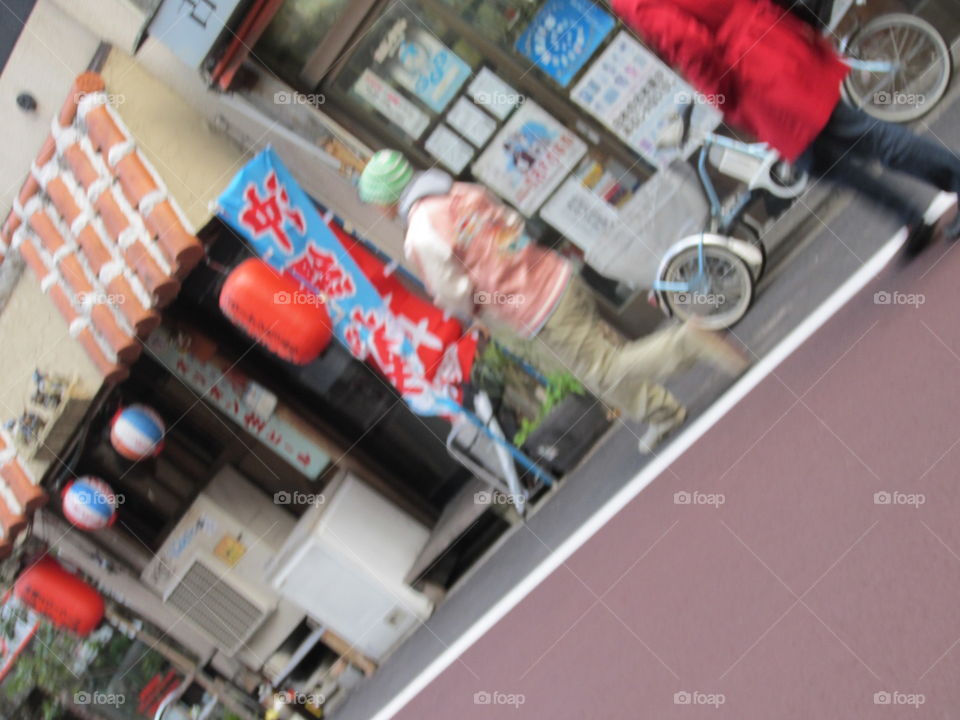 Nakameguro, Tokyo, Japan.  Shop Front, Bicycle, Man and Paper Lanterns