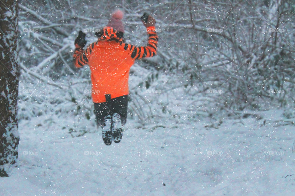 Re-submitting this shot because I learnt how to add snow with desktop tools; like my own private snow machine! My daughter, the bouncy tiger, happily jumped in the air for a picture op. Snow is perfect for playtime and family time!