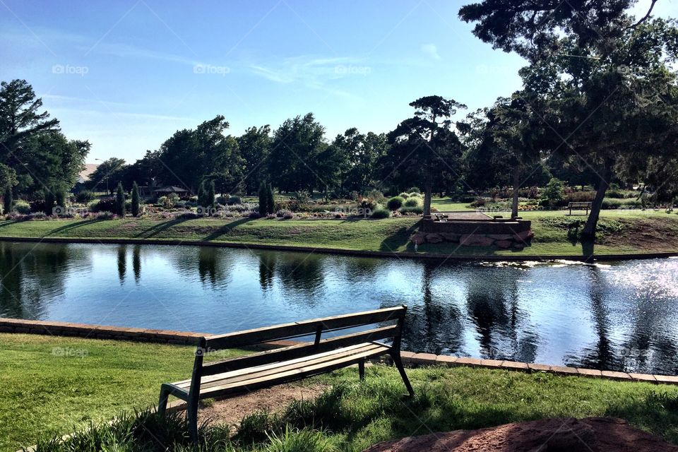 A city park and gardens with lake. 