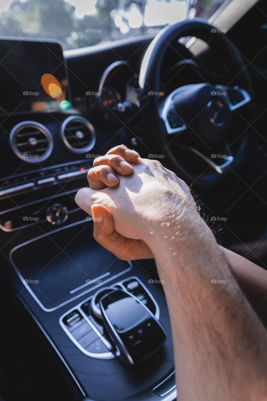 Holding hands in Mercedes car